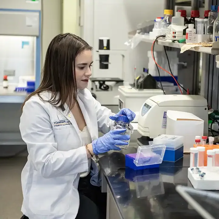 Female pharmacy student working in the lab.